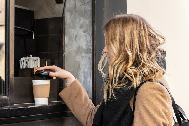 paper cup of hot coffee
